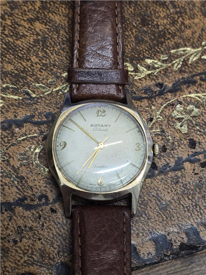 9ct yellow gold Rotary watch with a round dial, classic design, and gold-tone bracelet, displayed on a plain background.