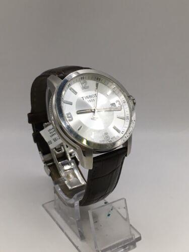 Elegant Tissot men's watch with a sleek design, featuring a round dial and stainless steel band.