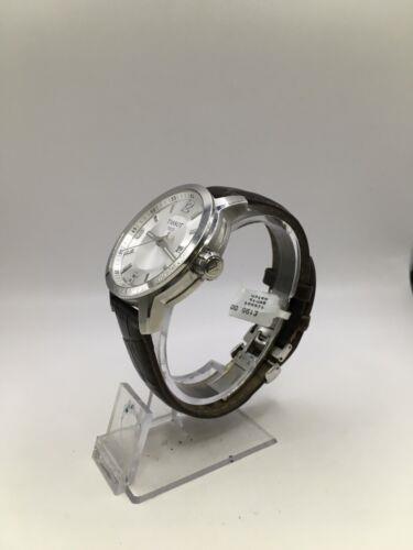 Elegant Tissot gents' watch with stainless steel bracelet and classic dial, showcasing sophisticated Swiss watch design.