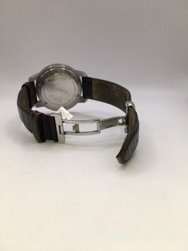 Elegant Tissot gents' watch with a sleek metal band and classic dial, showcasing sophisticated Swiss watch craftsmanship.