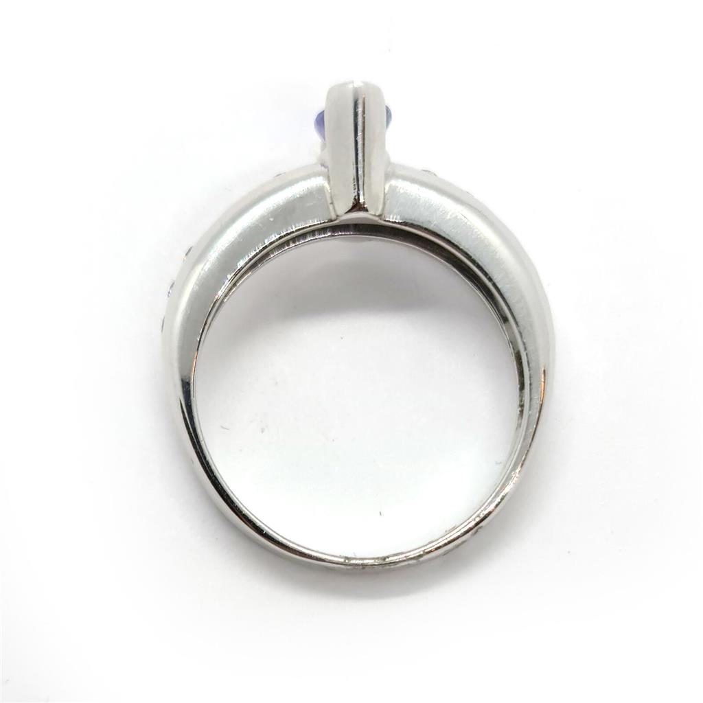 14ct tanzanite and diamond ring with a silver band, featuring a prominent oval tanzanite gemstone and small sparkling diamonds.