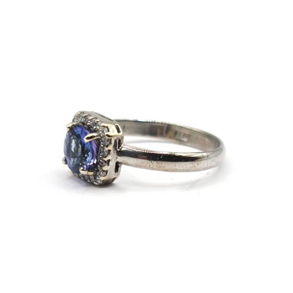 14ct diamond halo style ring with 1.10 CRT diamonds, featuring a sparkling center and intricate band design.