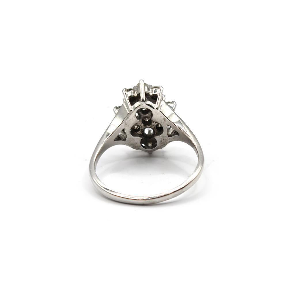 14ct white gold diamond cluster ring with 1.12 carats of sparkling diamonds, showcasing an elegant and intricate design.