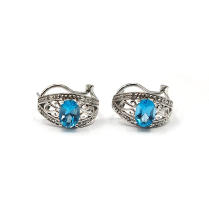 14ct white gold topaz and diamond earrings with post and lever back, showcasing sparkling gemstones and elegant design.