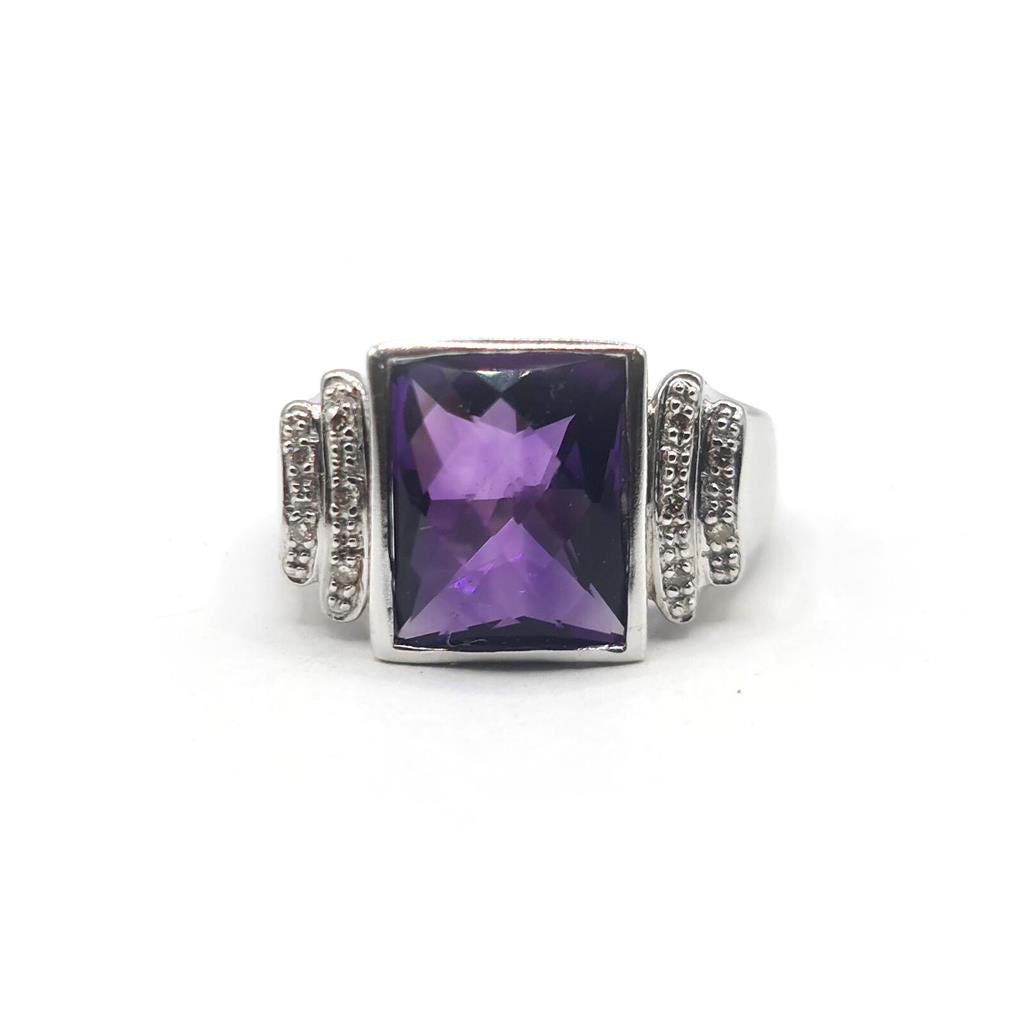 14ct white gold ring featuring a 4.25 carat purple amethyst center stone with diamond accents, unbranded jewelry accessory.