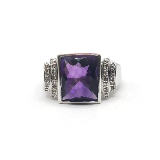 14ct white gold ring featuring a 4.25 carat purple amethyst center stone with diamond accents, unbranded jewelry accessory.