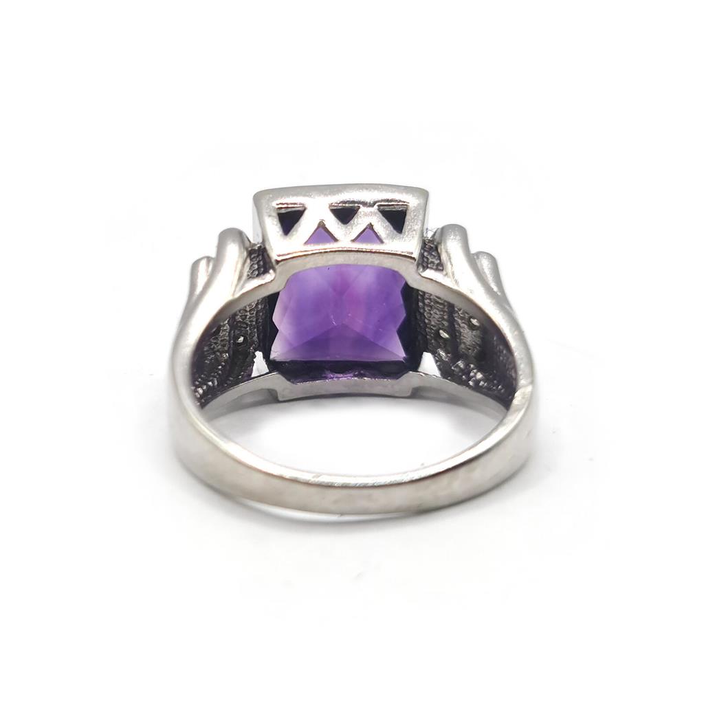 14ct white gold ring featuring a 4.25 carat purple amethyst center stone with diamond accents, unbranded jewelry accessory.