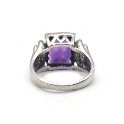 14ct white gold ring featuring a 4.25 carat purple amethyst center stone with diamond accents, unbranded jewelry accessory.