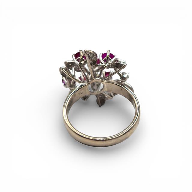 14ct white gold Ruby and diamond ring with a central ruby gemstone and sparkling diamonds, elegant jewelry piece.
