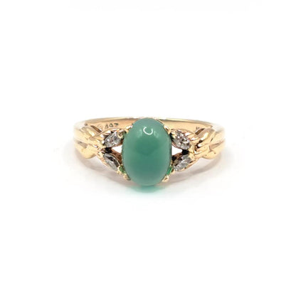 14ct yellow gold ring featuring a 1.15 carat chrysoprase gemstone accented with 0.20 carat diamonds.