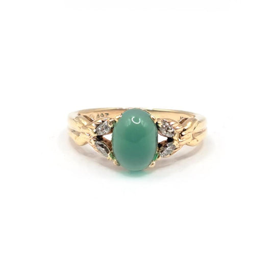 14ct yellow gold ring featuring a 1.15 carat chrysoprase gemstone accented with 0.20 carat diamonds.