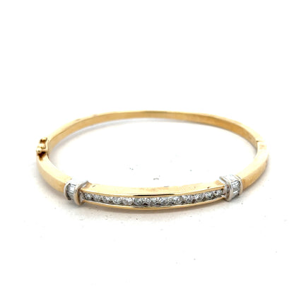 14ct yellow gold diamond bangle bracelet with 1 carat of sparkling diamonds and a weight of 17.5g, unbranded jewelry accessory.