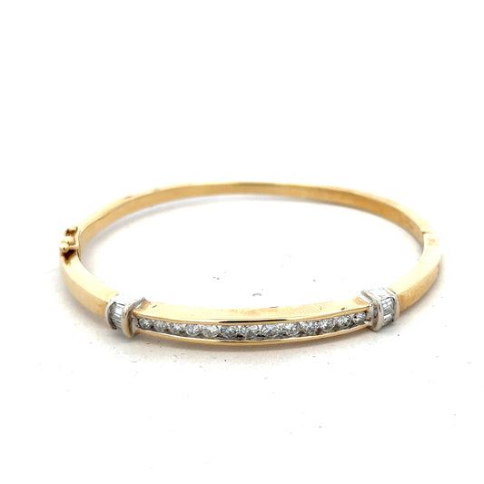 14ct yellow gold diamond bangle bracelet with 1 carat of sparkling diamonds and a weight of 17.5g, unbranded jewelry accessory.