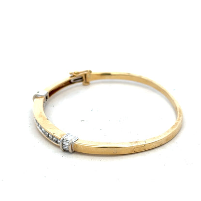 14ct yellow gold diamond bangle bracelet with 1-carat diamonds and 17.5g weight, showcasing a luxurious jewelry piece.
