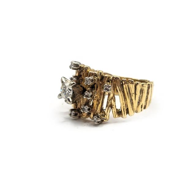14ct yellow gold diamond ring featuring a sparkling central diamond and elegant band design.
