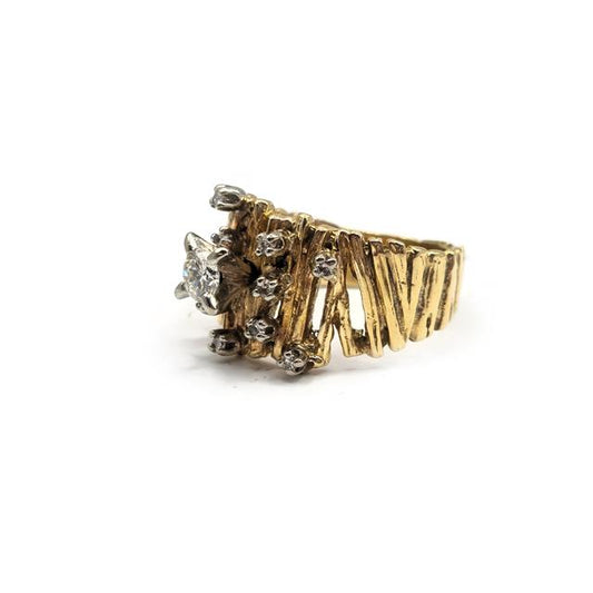 14ct yellow gold diamond ring featuring a sparkling central diamond and elegant band design.
