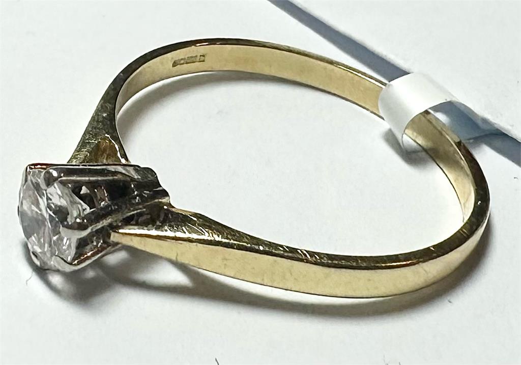 14ct yellow gold diamond ring in size P with sparkling diamonds, unbranded jewelry piece displayed on a neutral background.
