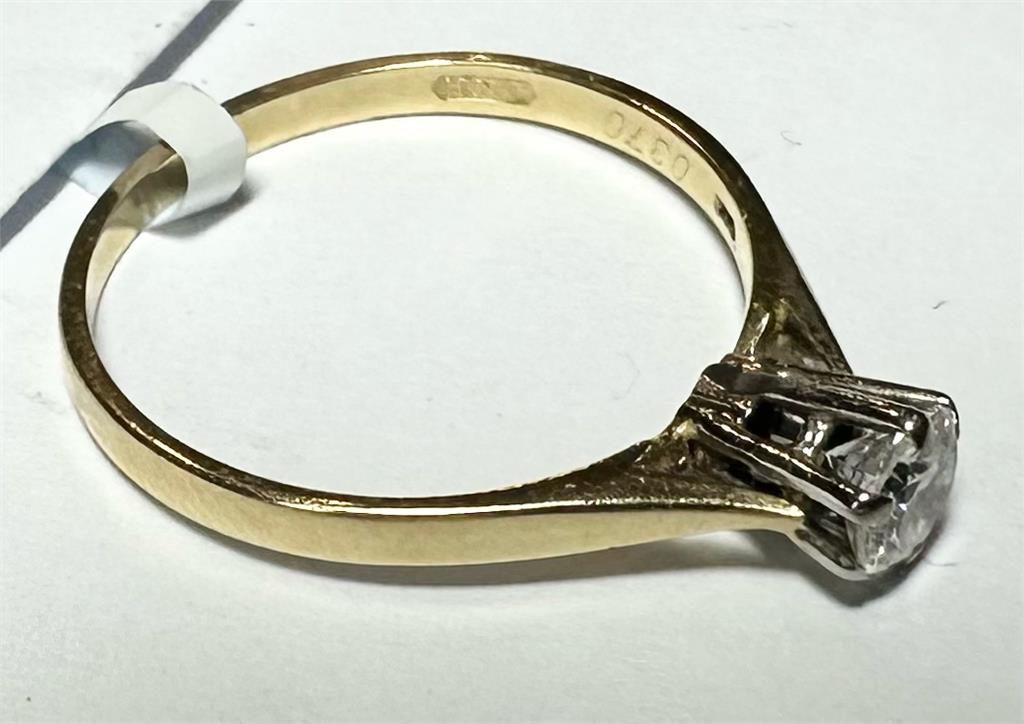 14ct yellow gold diamond ring in size P with a sparkling diamond setting, unbranded jewelry piece.