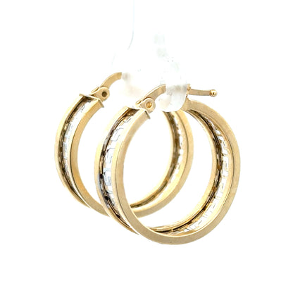 14ct yellow gold earrings with a simple, elegant design, weighing 4.2 grams, displayed on a neutral background.