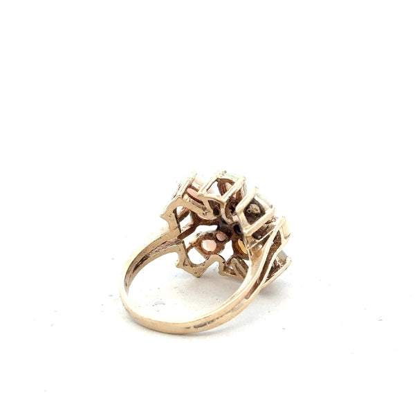 14k yellow gold opal ring in size L 1/2 with a vibrant opal gemstone, featuring a simple, elegant design.