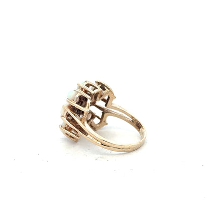 14ct yellow gold opal ring in size L1/2 featuring a vibrant opal gemstone on a simple gold band