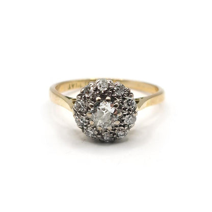 18ct gold diamond cluster ring with 0.55 carats of sparkling diamonds, featuring a elegant design and unbranded craftsmanship.