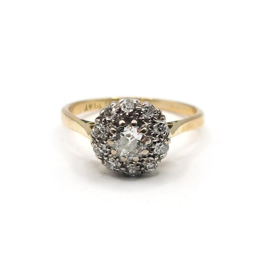 18ct gold diamond cluster ring with 0.55 carats of sparkling diamonds, featuring a elegant design and unbranded craftsmanship.