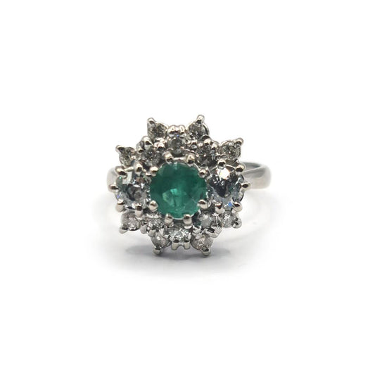 Elegant unbranded 18ct gold ring featuring a 0.65 carat emerald and 1.15 carat diamond centerpiece.