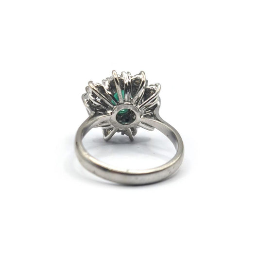 Elegant unbranded 18ct gold ring featuring a 0.65 carat emerald and 1.15 carat diamond centerpiece.