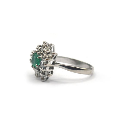 18ct gold ring featuring a 0.65 carat emerald and 1.15 carat diamond, elegant jewelry with sparkling gemstones.