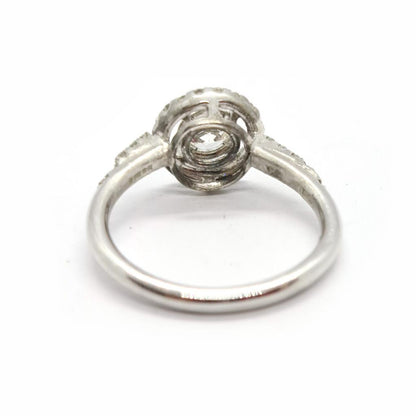 18ct gold diamond halo ring with 0.80ct central diamond and surrounding smaller diamonds, elegant jewelry accessory.