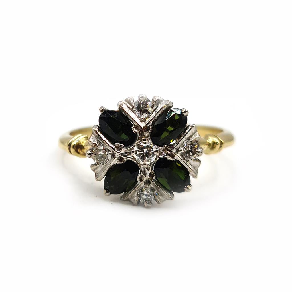 18ct gold ring with a 1-carat peridot gemstone and diamond accents, showcasing elegant jewelry design.