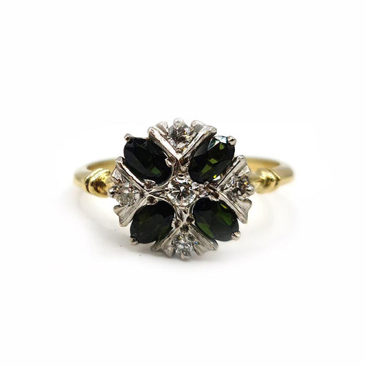 18ct gold ring with a 1-carat peridot gemstone and diamond accents, showcasing elegant jewelry design.
