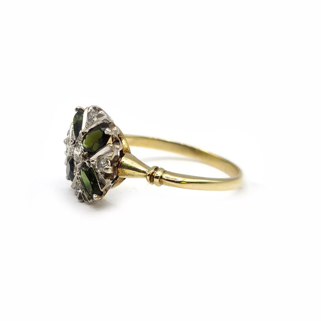 Elegant 18ct gold ring featuring a 1-carat peridot gemstone accented with small diamonds on a sleek band.