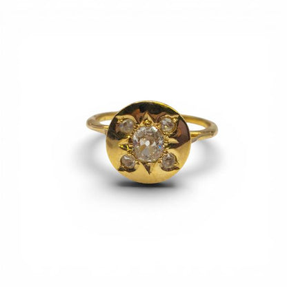 Antique 18ct yellow gold diamond ring featuring intricate design and sparkling diamonds, unbranded jewelry piece.