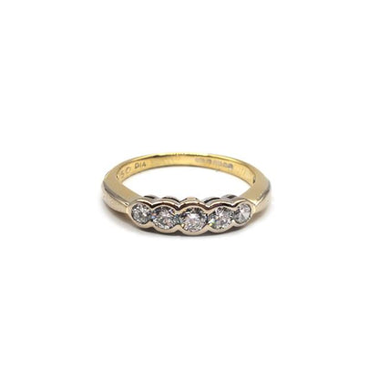 18ct diamond ring with a sleek band and sparkling diamonds, showcasing elegant jewelry design.