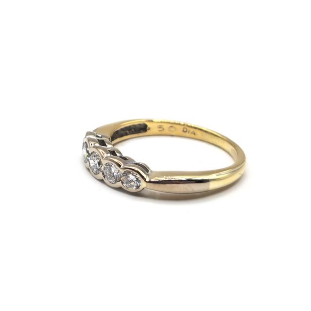 18ct diamond ring with sparkling diamonds set in a sleek band, showcasing elegant jewelry design.