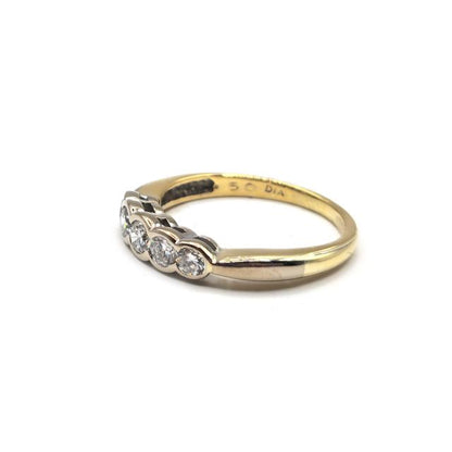18ct diamond ring with sparkling diamonds set in a sleek band, showcasing elegant jewelry design.