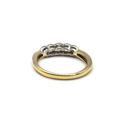 18ct diamond ring featuring a sparkling central diamond set in a sleek band, unbranded jewelry design.