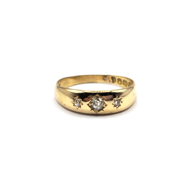 18ct diamond ring featuring sparkling diamonds set in a sleek band, unbranded jewelry piece with elegant design.