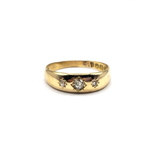 18ct diamond ring featuring sparkling diamonds set in a sleek band, unbranded jewelry piece with elegant design.