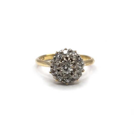 Unbranded 18ct diamond ring with a sparkling gemstone set in a sleek band, showcasing fine craftsmanship and elegance.