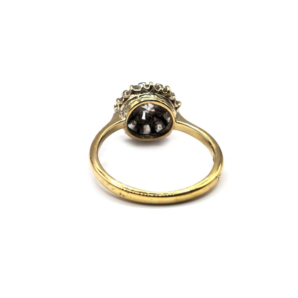 18ct diamond ring with a sparkling central diamond and a sleek band, unbranded jewelry piece.