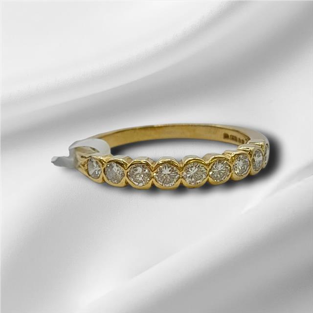 18ct diamond ring in size N with a classic band, featuring sparkling diamonds set in a sleek unbranded design.