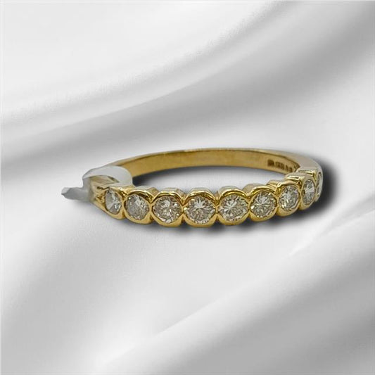 18ct diamond ring in size N with a classic band, featuring sparkling diamonds set in a sleek unbranded design.