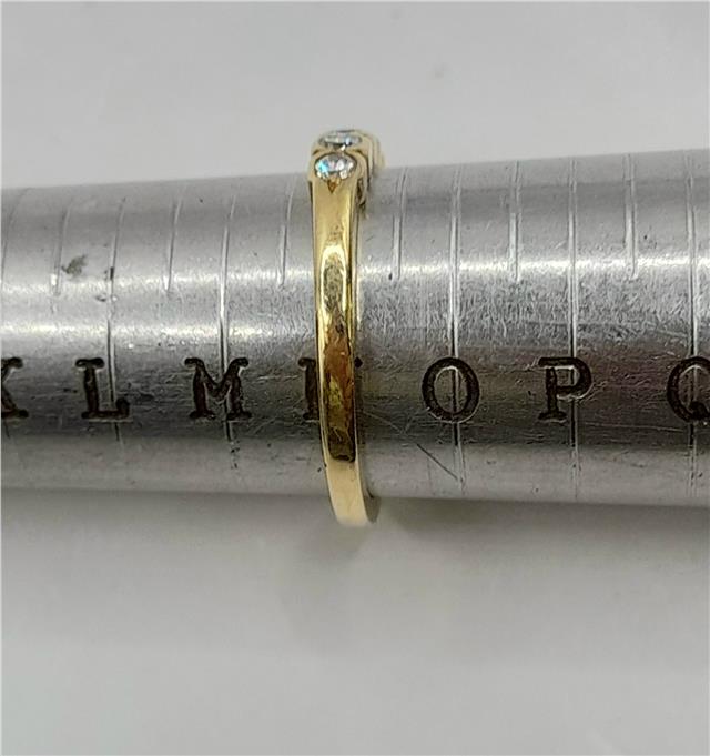 18ct diamond ring in size N featuring a sparkling diamond setting, unbranded jewelry piece with elegant design.
