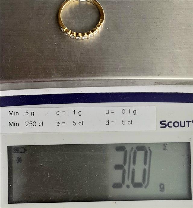 18ct diamond ring in size N with sparkling diamonds, featuring a sleek band design, unbranded jewelry piece.