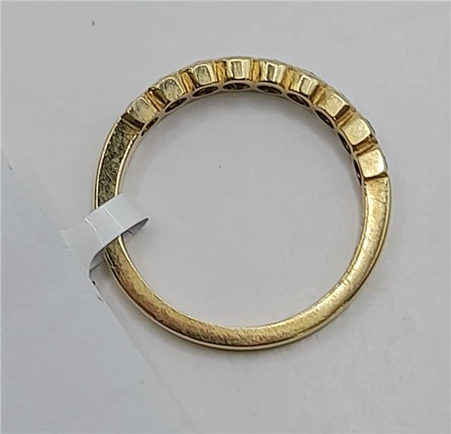18ct diamond ring in size N featuring a sparkling diamond set in a sleek band, unbranded jewelry piece.