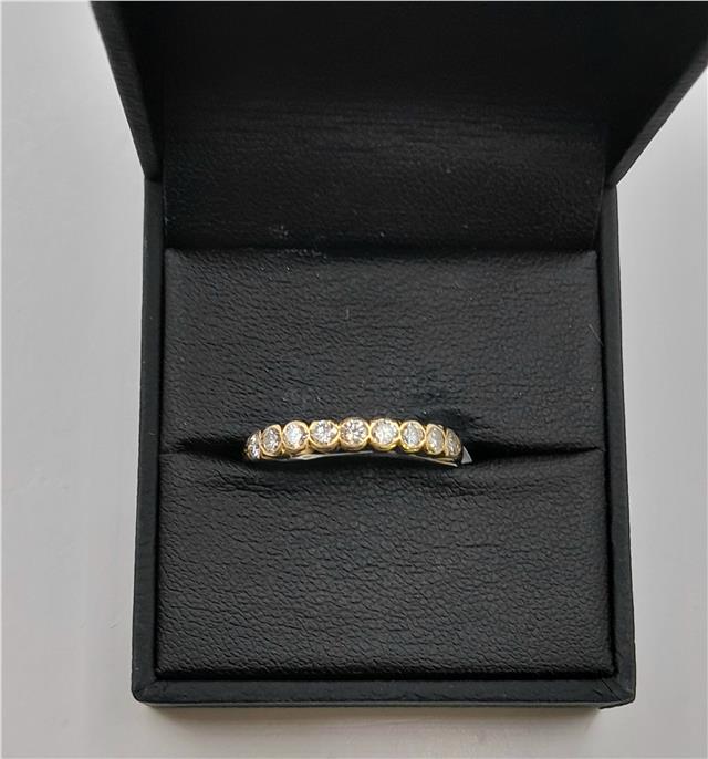 18ct diamond ring in size N featuring a sparkling diamond setting, displayed on a neutral background.