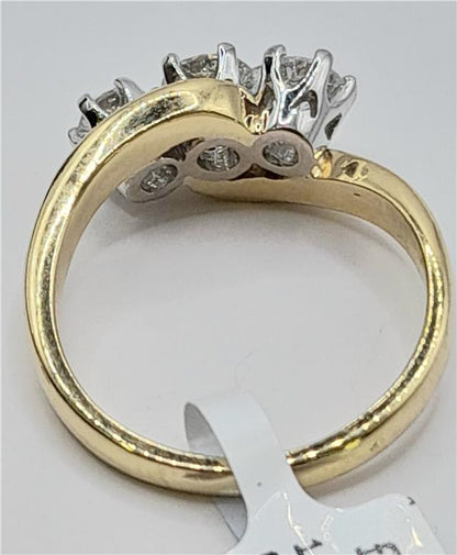 18ct gold diamond ring with 0.75 carats of diamonds in size L, featuring a sleek band and sparkling gemstone details.